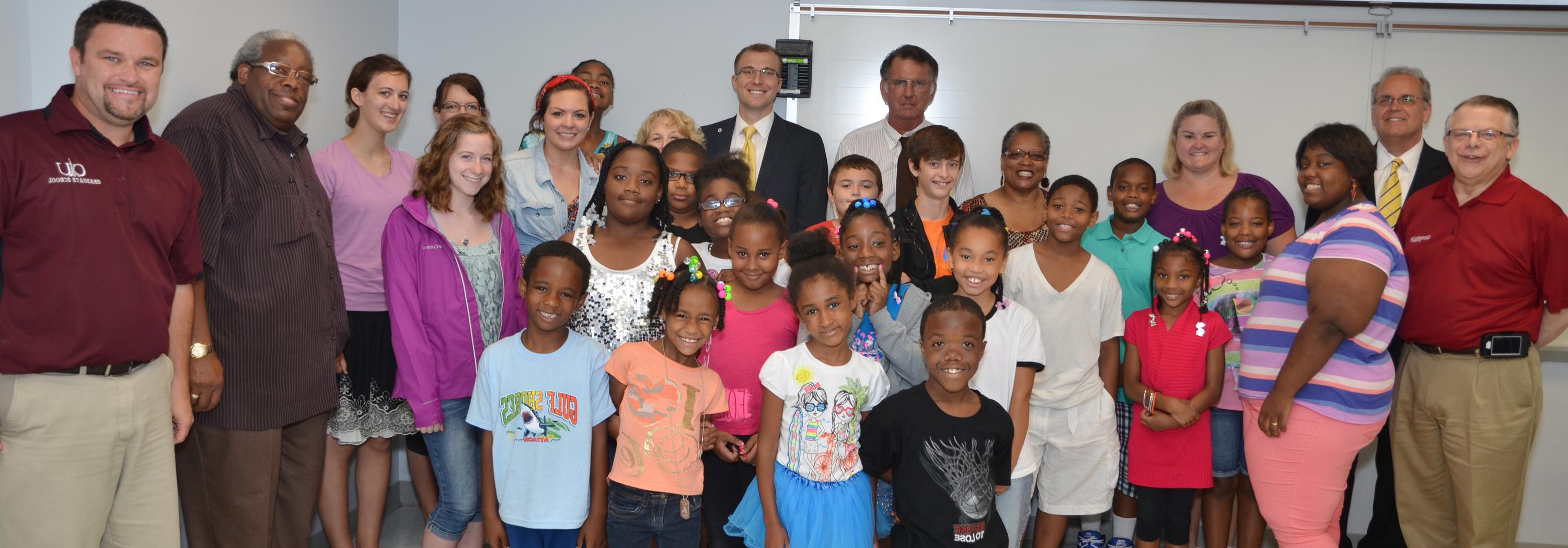 The Baptist Fellowship Center hosted a Day Camp at CU where students were encouraged to stay in school. From left to right: First row -  Rashad Reed, Crissy Eskridge, E’lishay Richardson, and Justin Shell, Jr. Second row -  Anyiah Scales, Sanya Bledshaw, Makayla Conn, Makayla Bledshaw, Jordan Snider, Rev. Matthew Smyzer, executive director of the Baptist Fellowship Center and a CU Board of Trustees and CU Church Relations Council member and former chair, and Dr. DeWayne Frazier, associate vice president for academic affairs. Third row – Angel Woodson, Kellyn Dailey, Jamaya Anthony, Kevin Dailey, Cecil Price, Joel Laffoon, James Thompson, Jurni Woodson, Malachi McDaniel, Reagan Jones and Hanna Deaton. Last Row – John Chowning, vice president for church and external relations and executive assistant to the president of Campbellsville University, Tony Young, Campbellsville mayor, Jammie Stone, Wanda Washington, Jerry Snelling, Dale Smothers, admissions counselor, Jeannie Laffoon, Ja’naya Richardson and Martha Deaton. (Campbellsville University Photo by Drew Tucker)