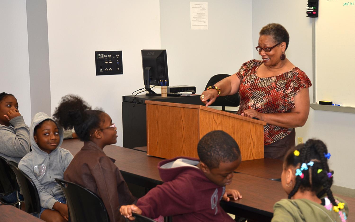 At the beginning of her presentation, Wanda Washington lent her jacket to cold Jurni Woodson. (Campbellsville University Photo by Drew Tucker)